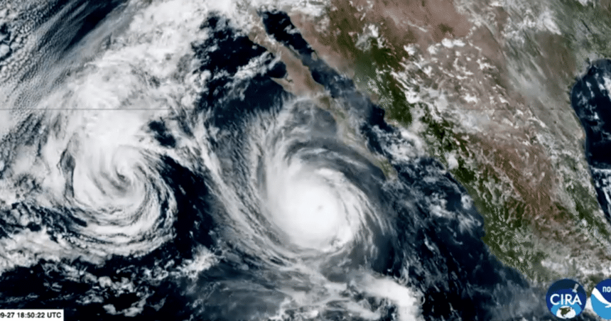 Paisagem costeira afetada por fortes ventos e mar agitado durante a aproximação de tempestade tropical.